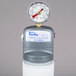 A Manitowoc Arctic Pure water filtration system with a pressure gauge on top.