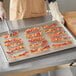 Baker's Mark 16 7/16" x 24 1/2" Stainless Steel Footed Wire Cooling Rack for Full Size Sheet Pan Main Thumbnail 4