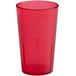 A red plastic tumbler with a textured surface.