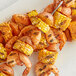 Grilled shrimp and corn skewers on a plate with Backyard Pro Chesapeake Seasoning Blend.