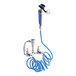A Waterloo pet grooming faucet with a blue coiled hose attached.