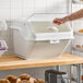 A large white ingredient bin with a flip lid, label, and scoop, designed for storing bulk baking ingredients.