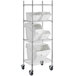 A white Baker's Mark shelving unit with 5 clip-in storage bins on metal shelves.