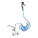 A Waterloo pet grooming faucet with a blue coiled hose attached.