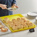 A tray of biscuits on a table with a close up of biscuits on a tray.
