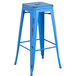 A blue metal Lancaster Table & Seating backless barstool with a square seat.