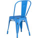 A Lancaster Table & Seating distressed blue metal chair with a seat and back.