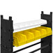 A black and yellow rack with white bins on black and white shelves.