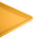 A close up of a yellow Cambro dietary tray.