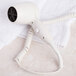 A white Conair wall mount hair dryer on a white towel.