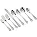 A close-up of Acopa Capulet stainless steel oyster forks.