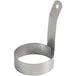 A stainless steel egg ring with a long handle.