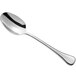 A Sant'Andrea Puccini stainless steel spoon with an oval bowl and a silver handle.