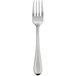 A stainless steel salad fork with a silver handle.