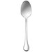 A Sant'Andrea Puccini stainless steel demitasse spoon with a white handle.