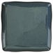 A white square porcelain plate with a speckled midnight blue surface.