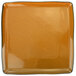A square terracotta porcelain plate with a black edge.