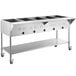 An Avantco stainless steel mobile electric steam table with an undershelf holding three trays of hot food.