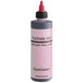 A close-up of a Chefmaster Fuchsia Red airbrush food color bottle.