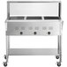 An Avantco stainless steel mobile electric steam table with three pans on a counter.