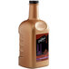 A brown plastic bottle of DaVinci Gourmet Dark Chocolate Flavoring Sauce with a black label.