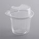 A clear plastic 12 oz. parfait cup with a clamshell pedestal lid.