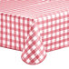 A red and white checkered Choice vinyl table cover with a textured gingham pattern and flannel back on a table.