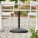 Lancaster Table & Seating 50 lb. Black Round Concrete Umbrella Base Main Thumbnail 1