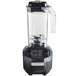 A Hamilton Beach commercial drink blender with a clear container and black lid.