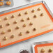 Baker's Mark 16 1/2" x 24 1/2" Full Size Heavy-Duty Orange Indexed Silicone Non-Stick Baking Mat Main Thumbnail 1
