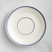 An Acopa ivory stoneware saucer with blue lines on it.