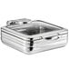 An Acopa stainless steel chafer with a glass lid on a counter.