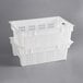 A stack of white Choice agricultural crates with vented sides.