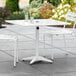 Lancaster Table & Seating 36" x 36" White Powder-Coated Aluminum Dining Height Outdoor Table with Umbrella Hole Main Thumbnail 1