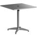 A Lancaster Table & Seating gray powder-coated aluminum table with a metal base.