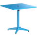 A blue square Lancaster Table & Seating outdoor table with a black umbrella on top.