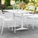 Lancaster Table & Seating 32" x 48" White Powder-Coated Aluminum Dining Height Outdoor Table with Umbrella Hole Main Thumbnail 1