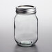 A clear glass Choice pint canning jar with a metal lid.
