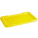 A yellow rectangular plastic lid for a meat lug.