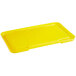 A yellow plastic tray with a recessed lid.