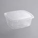A 64 oz. clear PET hinged container with a clear vented lid.