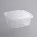 A 64 oz. clear PET tamper evident container with a vented lid.