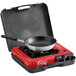 A brass Choice portable gas stove with a frying pan on top.