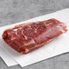 A Warrington Farm Meats coulotte steak on a white paper.