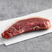 A Warrington Farm Meats Coulotte Steak on white paper.