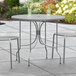 Lancaster Table & Seating Harbor Gray 36" Round Outdoor Standard Height Table with Ornate Legs Main Thumbnail 1
