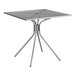 A Lancaster Table & Seating Harbor Gray square metal table with modern legs.