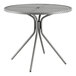 A Lancaster Table & Seating round outdoor table with a metal top and metal base.