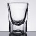 A close up of a Libbey fluted shot glass with clear glass.