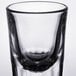 A Libbey fluted shot glass with a white background.